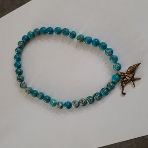 Turquoise like stone bead sea life necklace